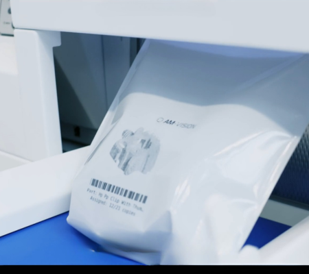 White bag labelled with image and barcode containing sorted part